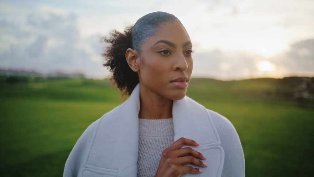 Comprehensive Care | Signature Precision Package Woman in coat outdoors at sunset